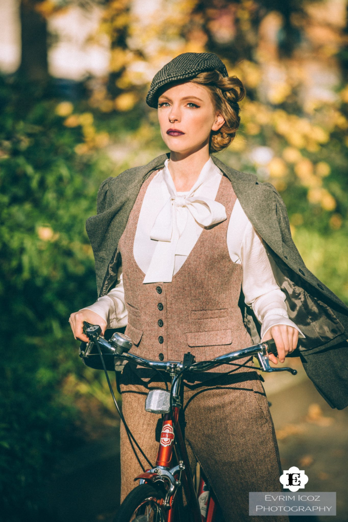 vintage girl with antique bike and pageboy hat