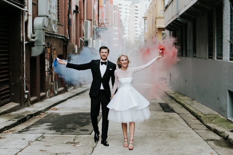 bride and groom with colorful sparklers