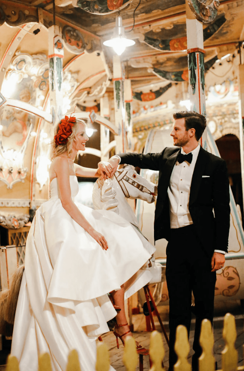 bride and groom on carousel 