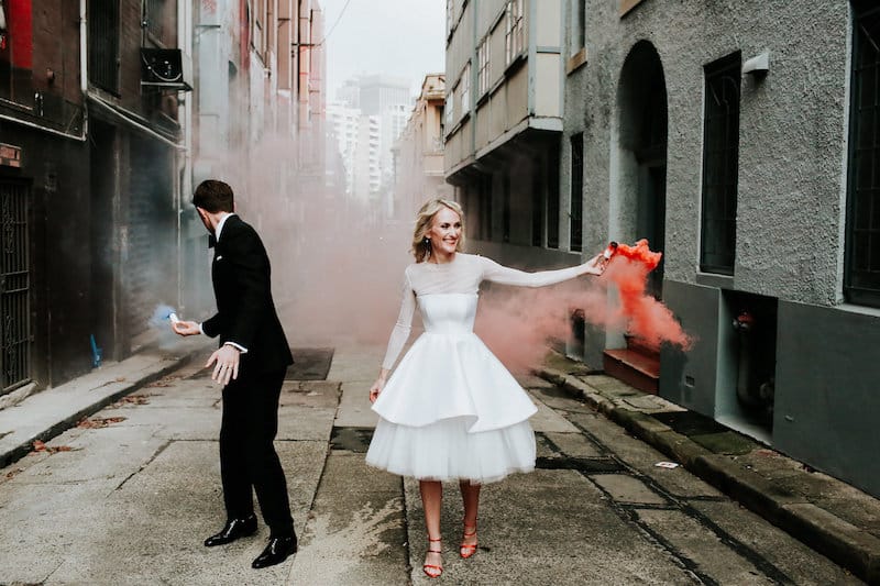 bride and groom with colorful sparklers