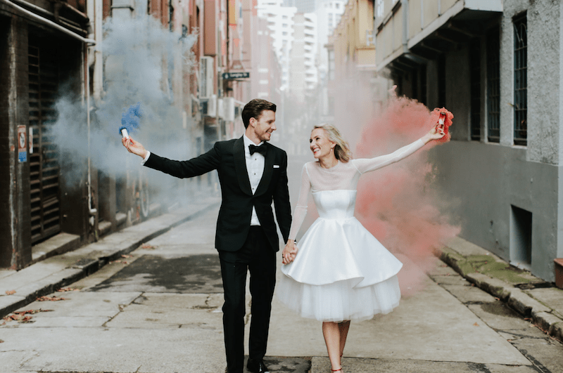 bride and groom with colorful sparklers
