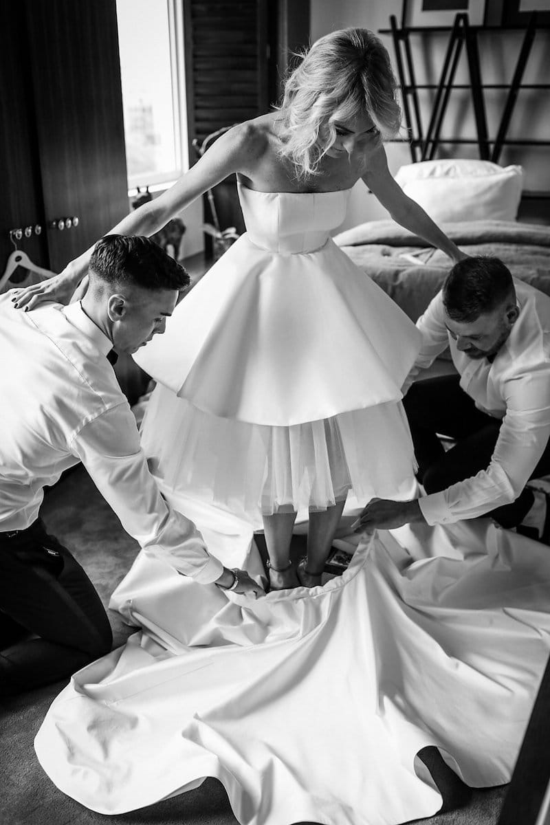 bride putting on detachable skirt