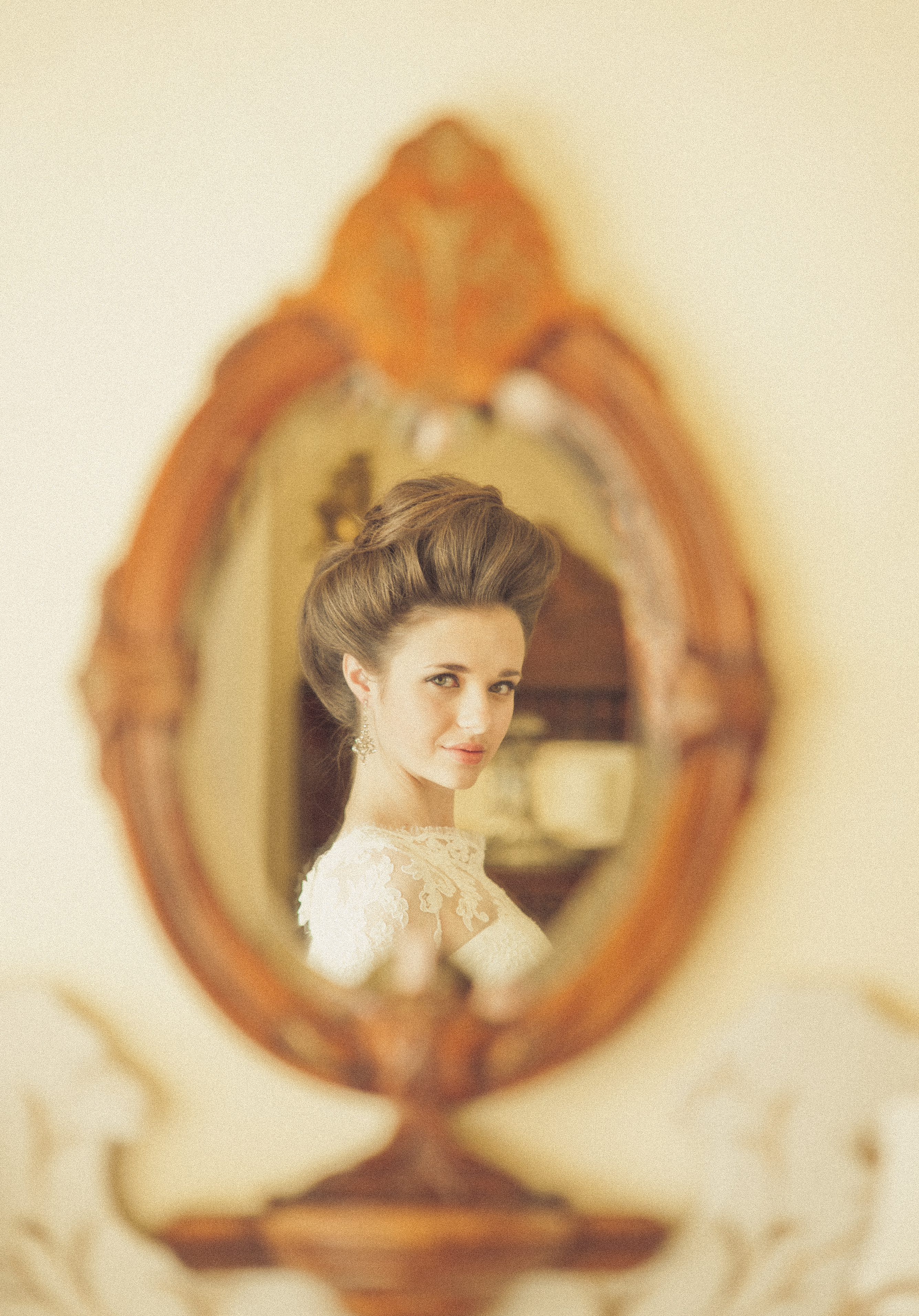 Victorian Era inspired wedding bride looking in mirror