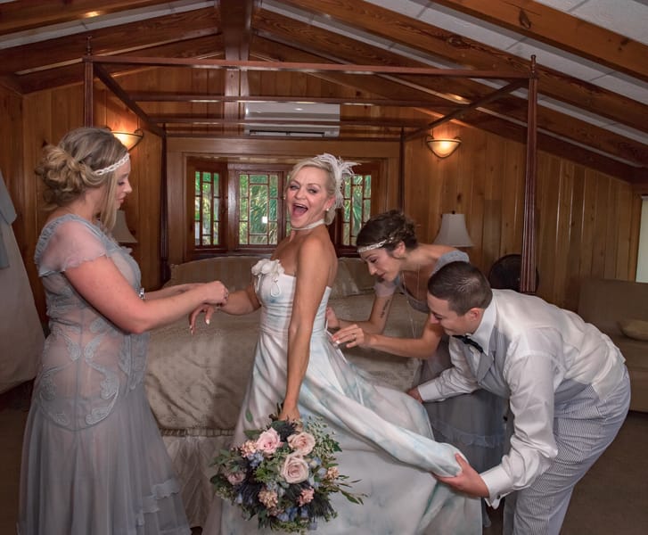 Florida-steampunk-wedding-bride-putting-on-dress