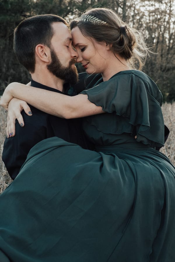 Jane-Eyre-Inspired-Anniversary-Shoot-groom-holding-bride-kiss