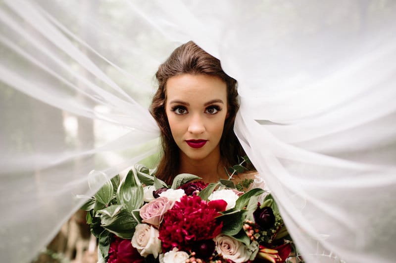 vintage forest styled shoot bride under veil shot