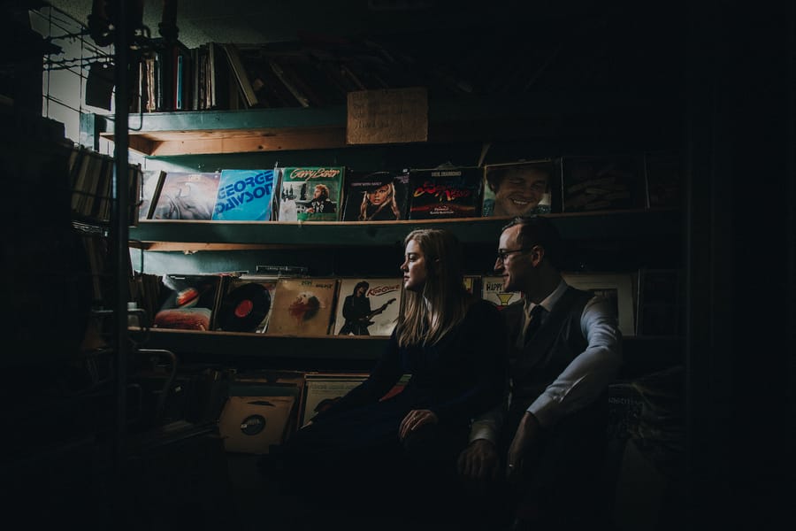 moody-antique-store-engagement-shoot-couple-record-store