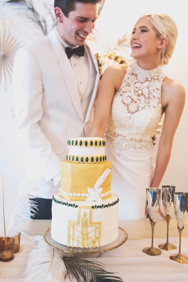 the-great-gatsby-styled-wedding-shoot-cutting-cake