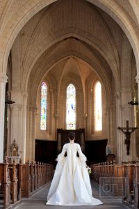 Marie Antoinette inspired wedding bride in historically accurate gown walking down the aisle in church