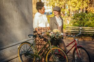 Portland Tweed Ride girls with vintage bikes standing