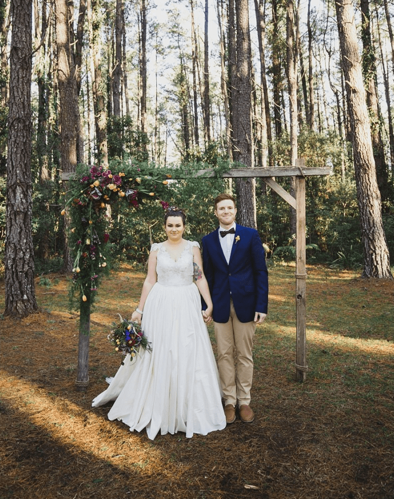 bride and groom standing at altar