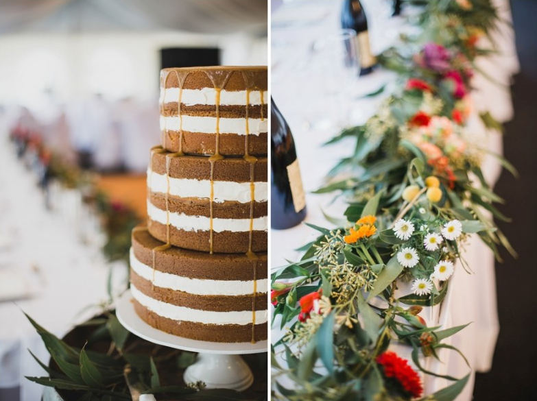naked wedding cake and wildflower center pieces