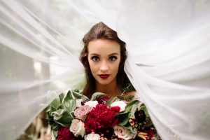 vintage forest styled shoot bride under veil shot