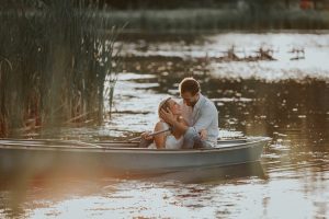 Vintage-Sunset-Canoe-Engagement-Shoot-hand-on-face