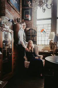 moody-antique-store-engagement-shoot-couple-chair